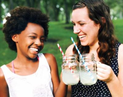 Big Sister and Little Sister cheersing lemonades