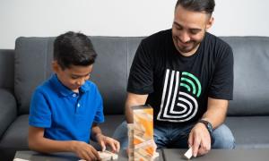 Big Brother and Little Brother playing jenga together